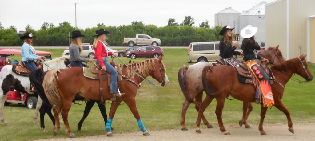 Riding in the Enderlin, ND Parade are Zannika Wobbema Miss Triple R Coteau Princess, Lydia Lyons Miss Bear Creek Roughriders Queen, Kayson Anderson Miss Hankinson Sandhills Saddle Club, Arial Lyons Miss Hankinson Sandhills Saddle Club Princess.